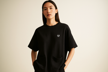 Oversized black unisex t-shirt with down pocket, made using sustainable fabric