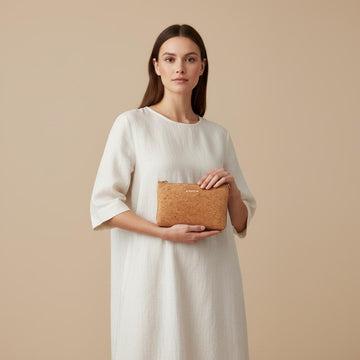 women holding the cork clutch purse